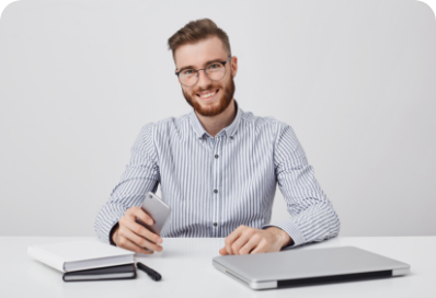 candid-shot-successful-male-with-thick-beard-uses-modern-technology-work
